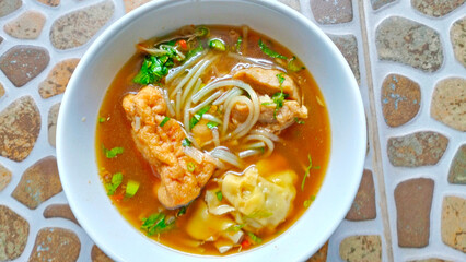 thai noodle soup with meatballs and tofu