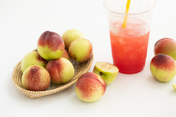 Fresh Organic Heavenly Peaches on white background.