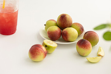 Fresh Organic Heavenly Peaches on white background.