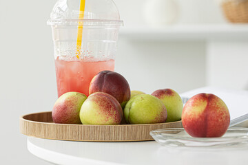 Fresh Organic Heavenly Peaches on white background.
