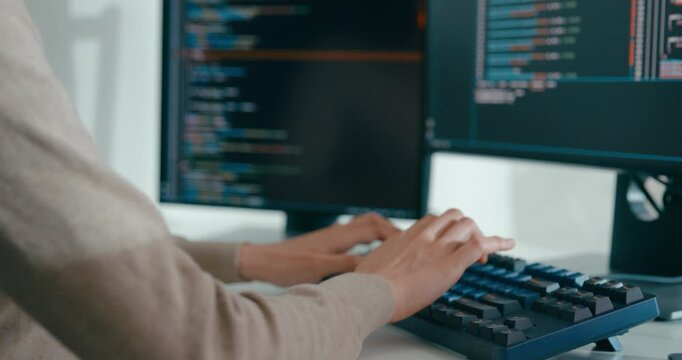 Closeup young adult Asia female freelance type write prompt AI bot IT app smart program nomad, video game, terminal with coding language, user interface, designer, big data center on desktop computer.