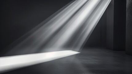 Obraz premium Focused beams of light break through the darkness, casting sharp shadows and creating an intense and dramatic visual composition.