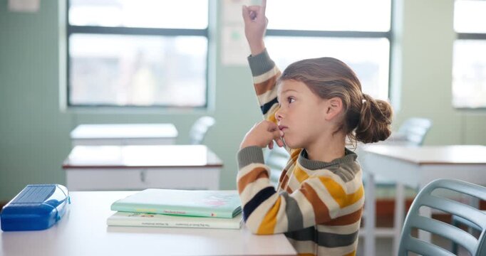 Education, question and hands raised with girl in classroom for learning, discussion and knowledge. Help, studying and kindergarten with children and books at school for why, scholarship and answer