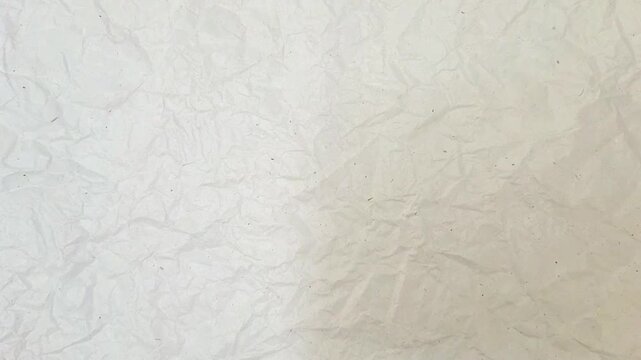 Rotating and zooming in real white paper texture background. plain white crumpled paper background looped spinning