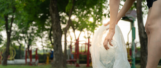 Save earth. Volunteer pick up trash garbage at the park and plastic bottles are difficult decompose...