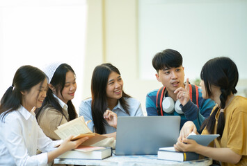 Group of students studying on campus outdoors