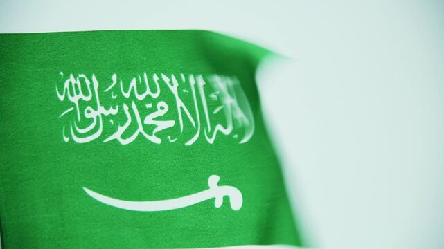 Saudi Arabia flag waving on white background