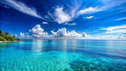 Serenely tranquil blue ocean horizon stretches to meet a clear cloudless sky, perfect for tropical island vacation getaways and relaxation.