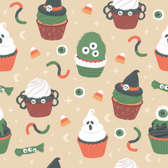 Halloween sweet cupcakes seamless pattern vector illustration