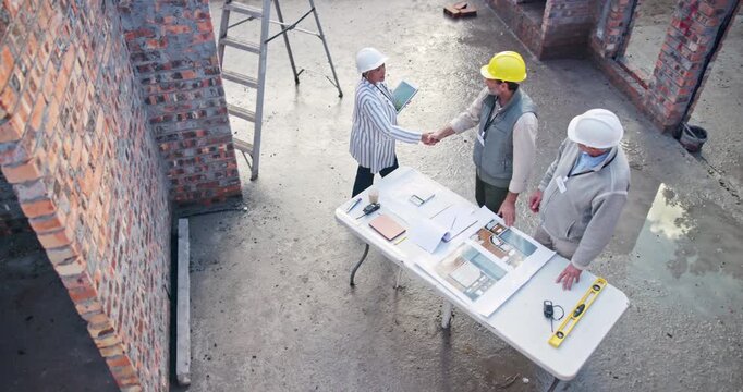 Construction, handshake and architects planning building, development and contractor agreement, Civil engineering, property management and people deal, teamwork and architecture collaboration