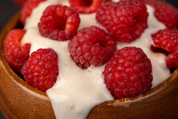 delicious and fresh yogurt with raspberry flavor and whole red raspberries