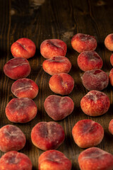 a pile of ripe washed peaches on the table