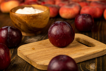 red ripe plum during cooking and slicing