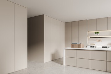 Beige home laundry interior with washing machine and cabinet, doorway