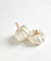 Two Garlic Bulbs Isolated on White Background.