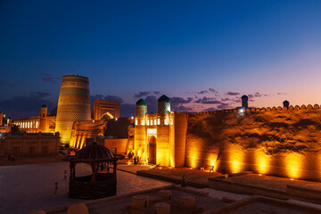 Kalta Minor Minaret and Hospitality Square illuminated at night.