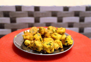 Popular street food item mix bhajiya snacks or Pakoda or Pakora