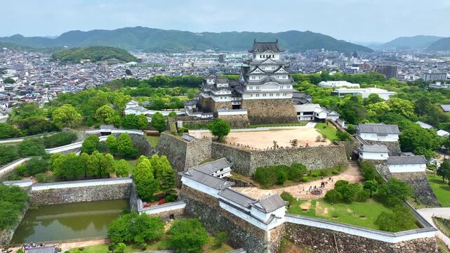 orbiting shot of Himeji castle in Japan, aerial view of a traditional Japanese samurai fort in Hyogo prefecture, travel in Japan, medieval castle of Himeji drone view