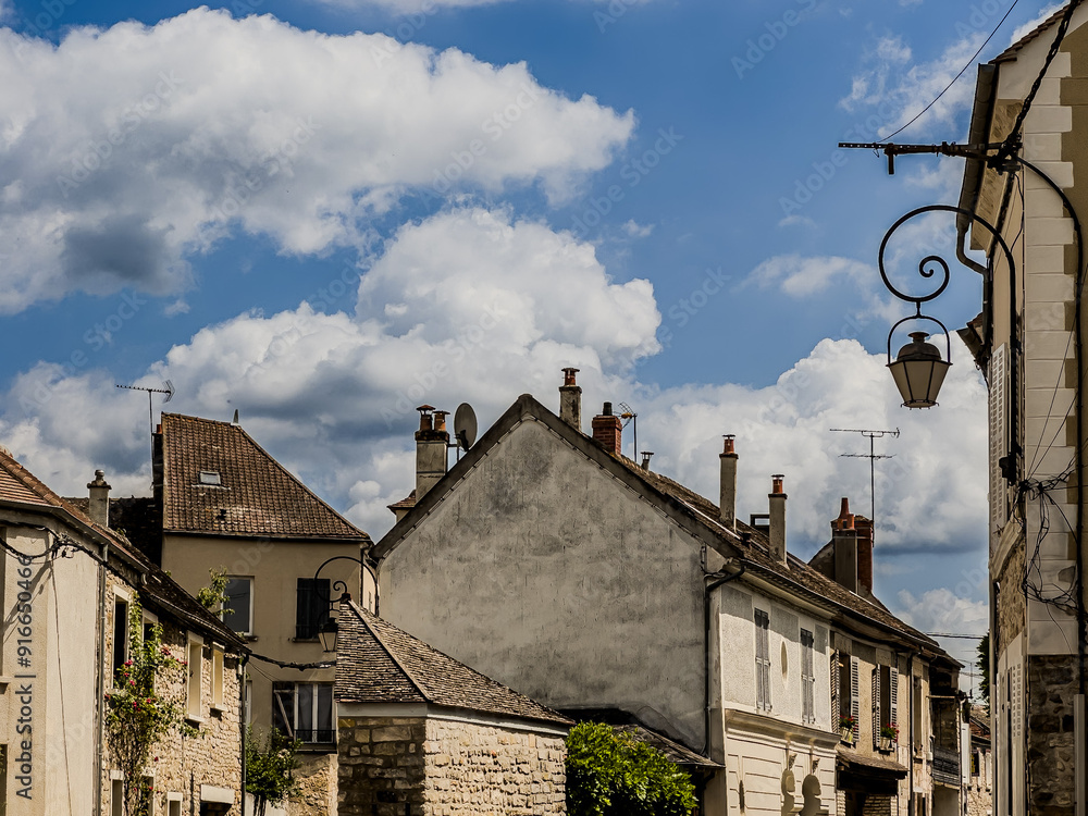 Wall mural Street view of old village Milly-la-Foret in France