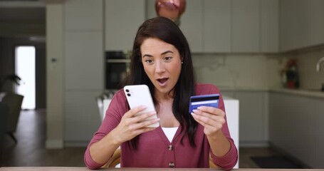 Woman hold card and phone try to pay unsuccessfully, feel dissatisfied due to transaction fail, insufficient funds, issues with card, security concerns, risking potential fraud, unauthorized charges