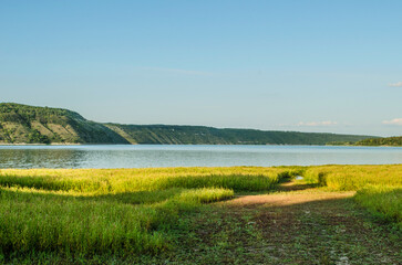 Landscape of Bakota River and mountains Ukraine Dniester River. Photo of the flooded village.   .   .