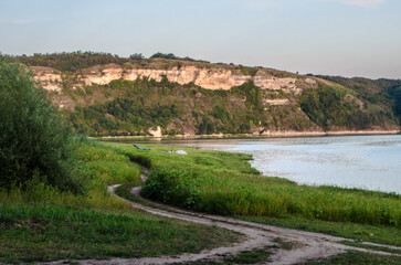 Landscape of Bakota River and mountains Ukraine Dniester River. Photo of the flooded village.   .   .
