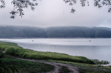 Landscape of Bakota River and mountains Ukraine Dniester River. Photo of the flooded village.   .   .