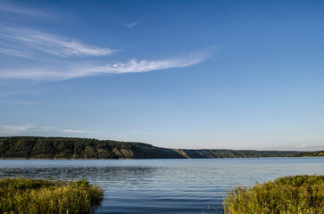 Landscape of Bakota River and mountains Ukraine Dniester River. Photo of the flooded village.   .   .