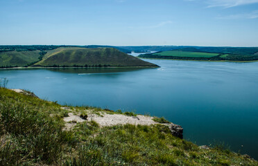 Landscape of Bakota River and mountains Ukraine Dniester River. Photo of the flooded village.   .   .
