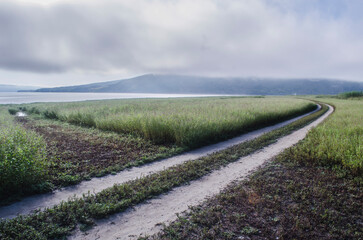 Landscape of Bakota River and mountains Ukraine Dniester River. Photo of the flooded village.   .   .