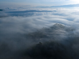 Naklejka premium Aerial scenery of a sea of clouds over the mountains in Yala Province, Thailand