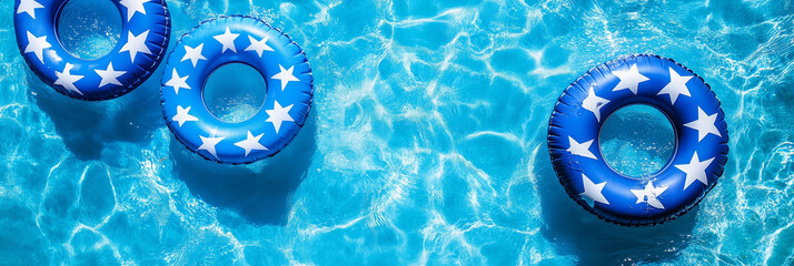 Patriotic themed pool floaters blue inflatable rings star pattern summer pool party decoration 4th of July USA independence day celebration swimming accessories aerial view