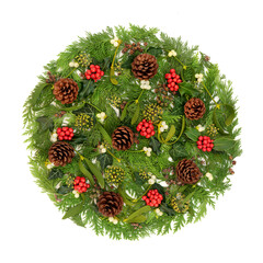 Winter solstice holly berry, mistletoe, ivy, cedar fir , pinecones on white. Natural Christmas...