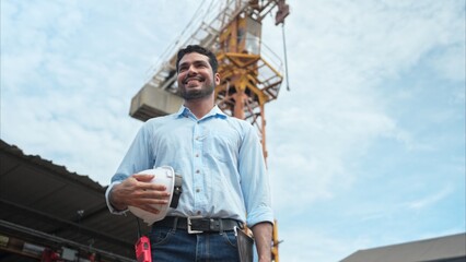 Portrait of engineer with tower crane for lift and move objects on building construction sites