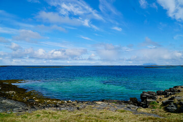 Vibrant blue waters and rocky shores of a Norwegian archipelago