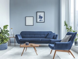 A blue sofa and two chairs sit in a living room with a blue wall. The room has a modern and clean look