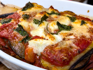 Delicious Traditional Parmigiana with Layered Eggplant, Tomato Sauce, and Melted Cheese