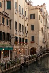 Venice, Italy - 06.15.2022: View of the Grand Canal from one of the city's walking streets