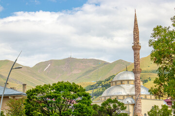 Haci Selim Efendi Mosque with palandoken mountain in Erzurum with ample space for text, representing peace, spirituality, and Islamic architecture. Islamic horizontal photo..
