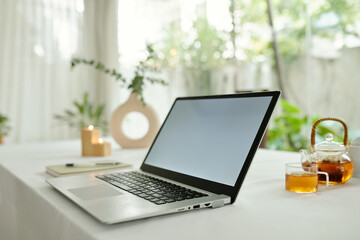 Fototapeta premium Laptop for freelance work on table in the room