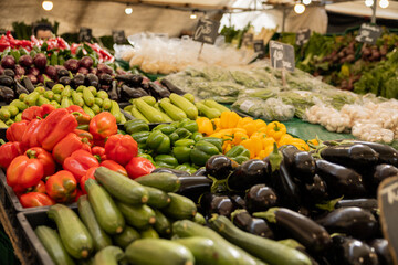 Vegetable like red and yellow peppers, zucchinis, artichokes, eggplants, mushrooms, at the market in Rotterdam. Healthy food, market stall, raw food.