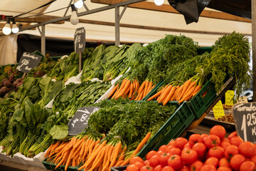 Carrots and other vegetables. Market stall at the weekly market in Rotterdam.