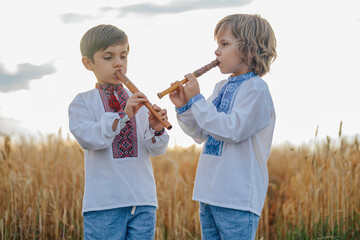 Little Boys Playing Folk Music On Woodwind Flutes - Ukrainian Sopilka Or Tylynka