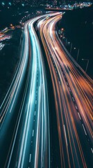 Urban Symphony at Night: A Bird's Eye View of a Bustling Highway at Dusk, with the Gliding Light Streams of Vehicles, Perfect for Themes of City, Traffic, and Urban Life