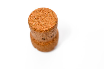 A single champagne cork isolated on a white background