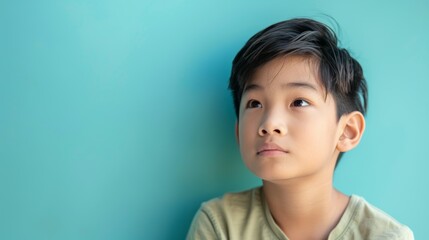 photo portrait of a handsome young Asian model teen boy looking forward. child ad with copy space, cute, kids, children