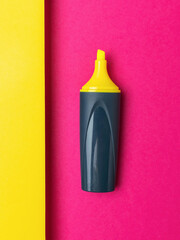 Colorful Highlighter Pen on Vibrant Yellow and Pink Background