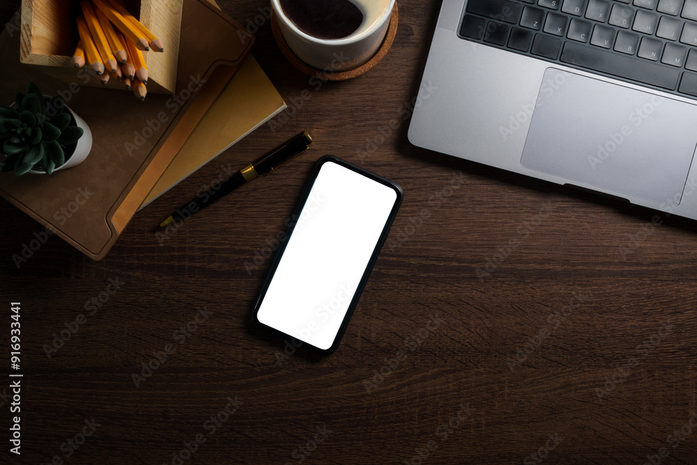 Poster smartphone, notebook, coffee cup and keyboard on rustic wooden table. top view with space for text.