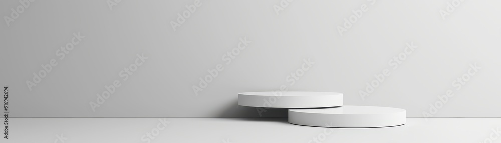 Poster minimalist composition featuring two white circular objects on a clean, grey background, ideal for m