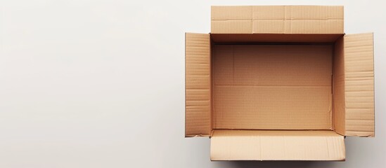 Isolated on a white background, a cardboard box offers plenty of copy space for images.